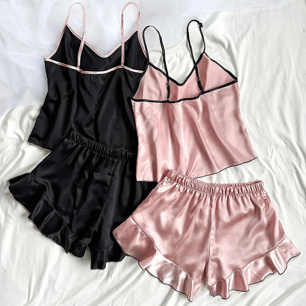 Black and pink satin nightgown set on a white background