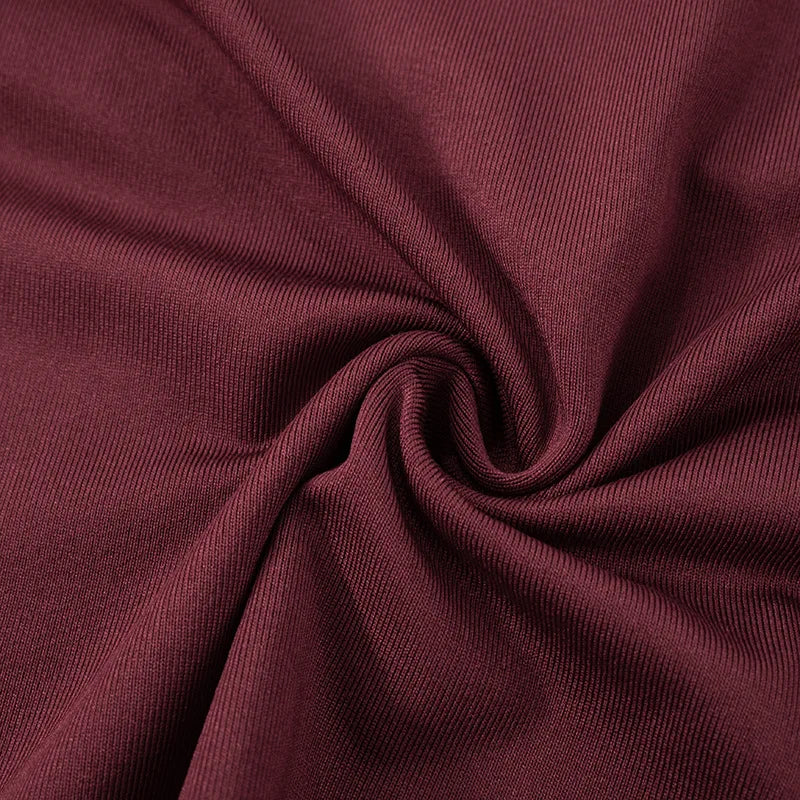 Close-up of maroon fabric with a swirl pattern
