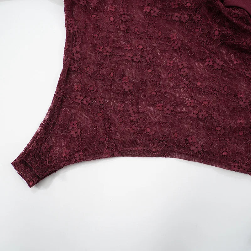 Maroon lace garment on a white background